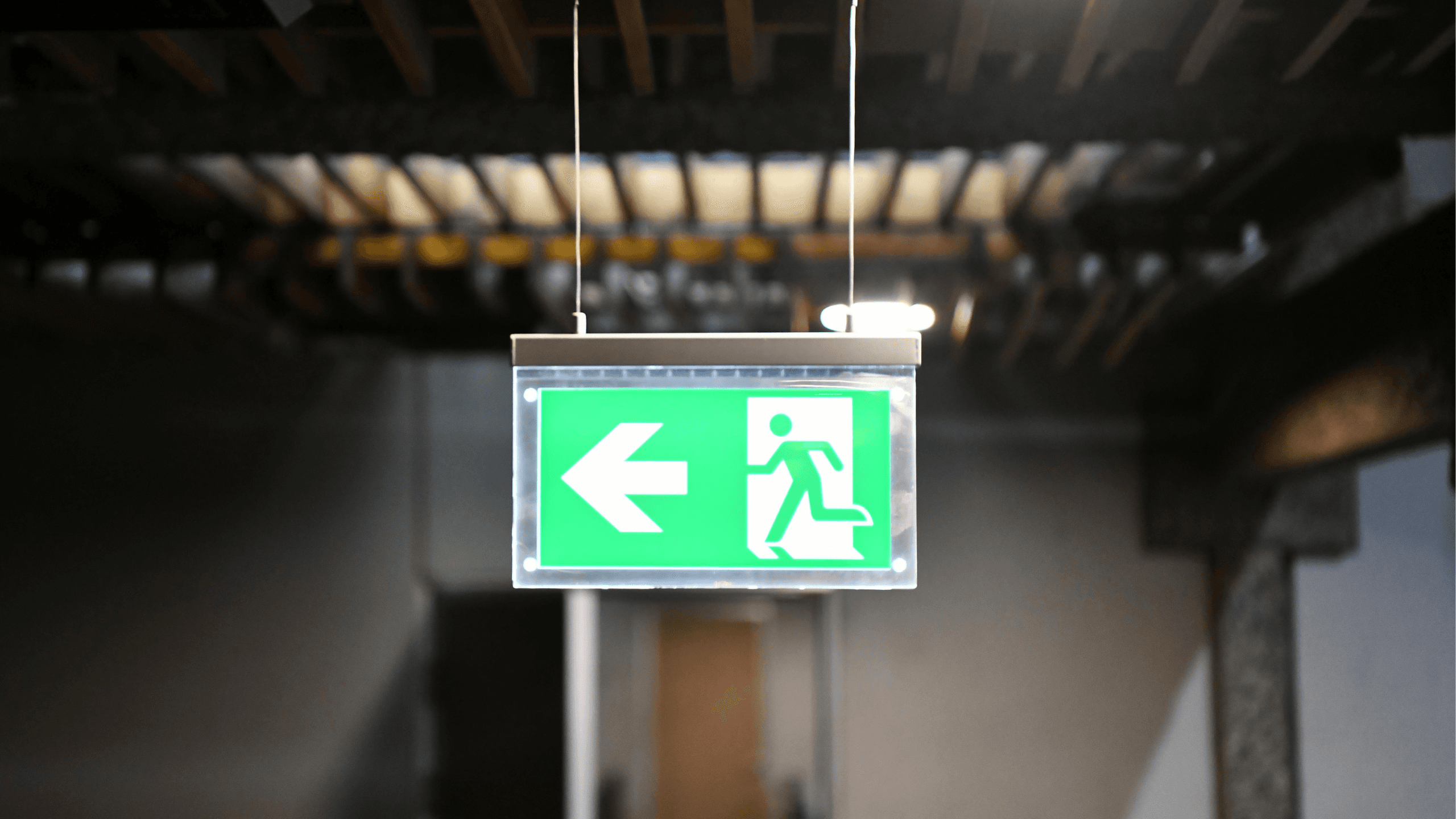 Green exit sign in stairwell
